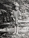Photo of barefoot young boy